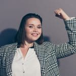 Closeup photo portrait of cheerful confident positive with toothy beaming smile she her lady office promoter demonstrating big muscles isolated grey background