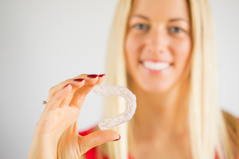 Why Do I Need Attachments on My Teeth During Invisalign? - Cory Liss Orthodontics - Orthodontists in Calgary - Featured Image