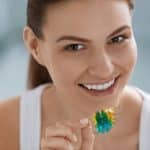 Woman with removable teeth braces for dental correction