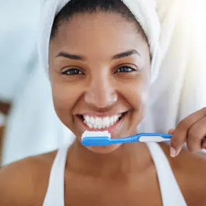 Woman brushing teeth